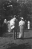Man and Woman (and others) Walking in Park - La Crosse, WI, July 28, 1915