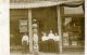 Unknown - Post Card - Four men in front of a building