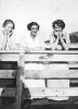 Three Girls by Fence